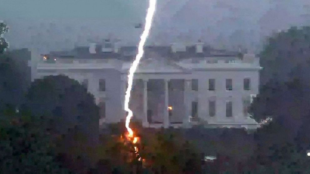 PHOTO: A lightning strike hits a tree in Lafayette Park across from the White House, killing three people and injuring one person below, during a thunderstorm in Washington, Aug. 4, 2022.