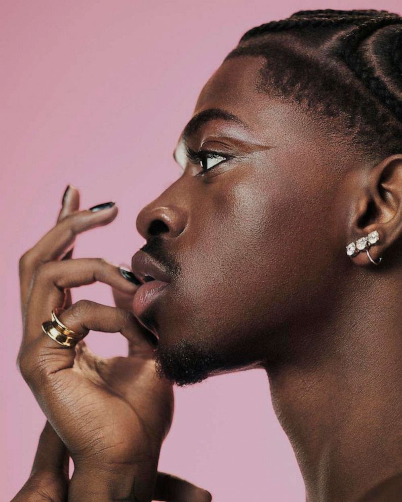 PHOTO: Lil Nas X poses for a photo against a pink backdrop for a new YSL Beauty campaign.