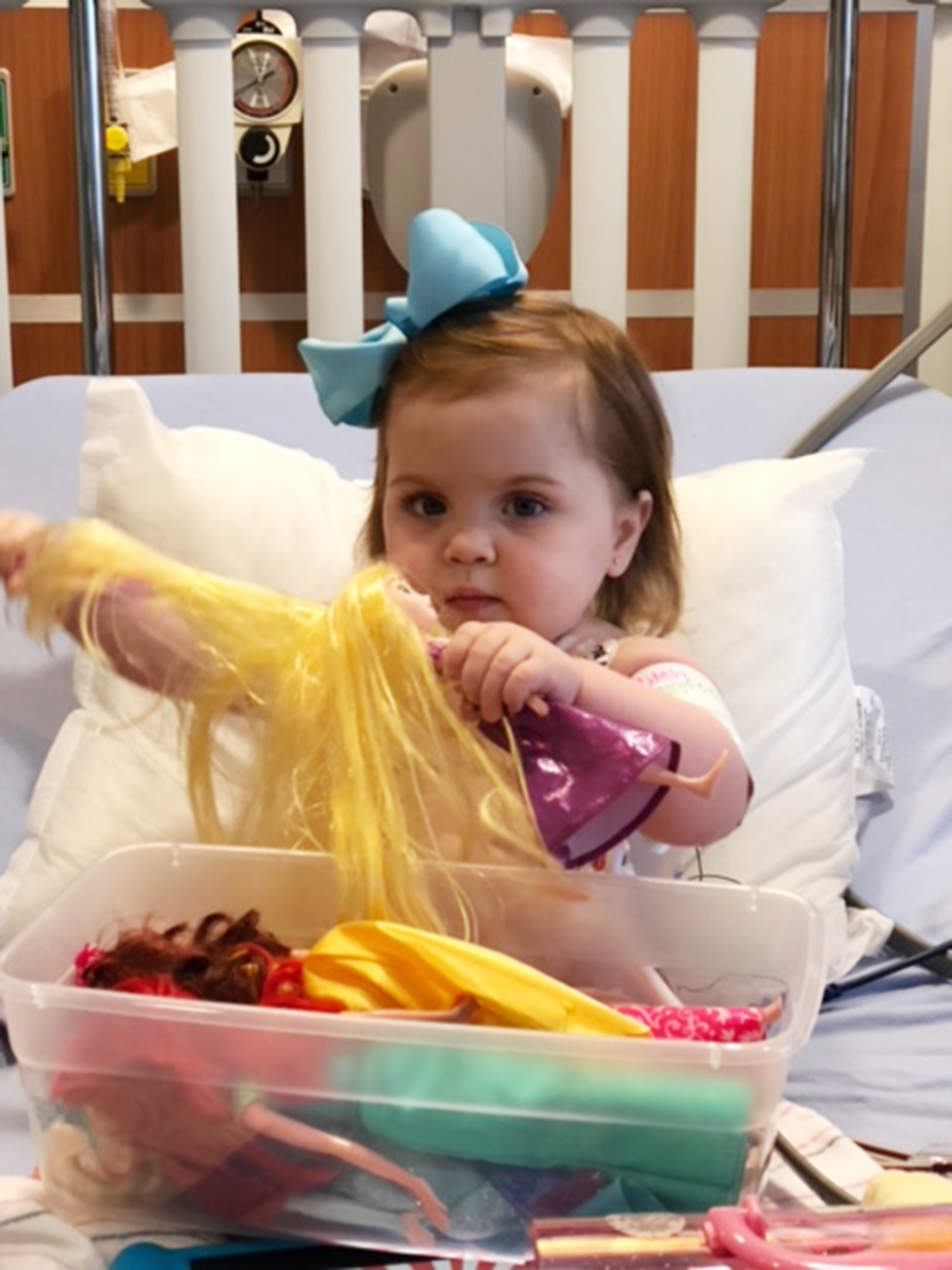 PHOTO: Lilah Joiner plays with a doll while in dialysis.