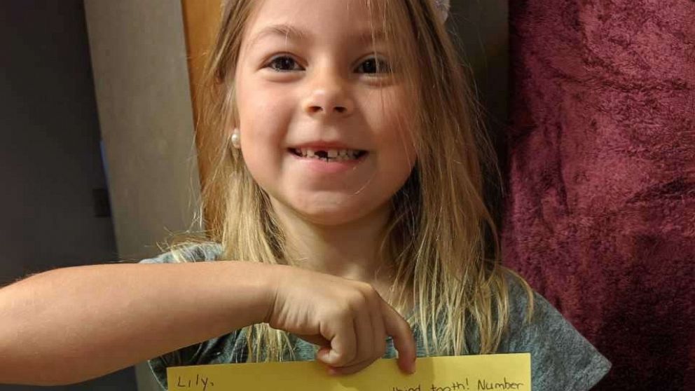 PHOTO: Lily Sciulli, 7, a first grade student at Burchfield Elementary School in Shaler Township, Pa., is shown in this undated photo holding a reply note signed by the tooth fairy. 