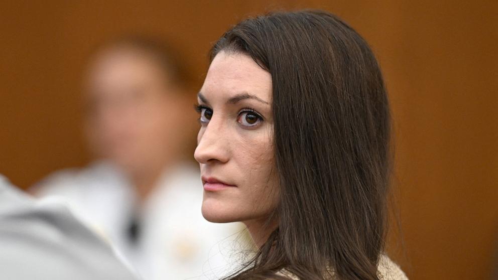 PHOTO: Lindsay Clancy, looks toward reporters in the courtroom during proceedings in her murder trial, in Plymouth, Massachusetts, August 20, 2026. 