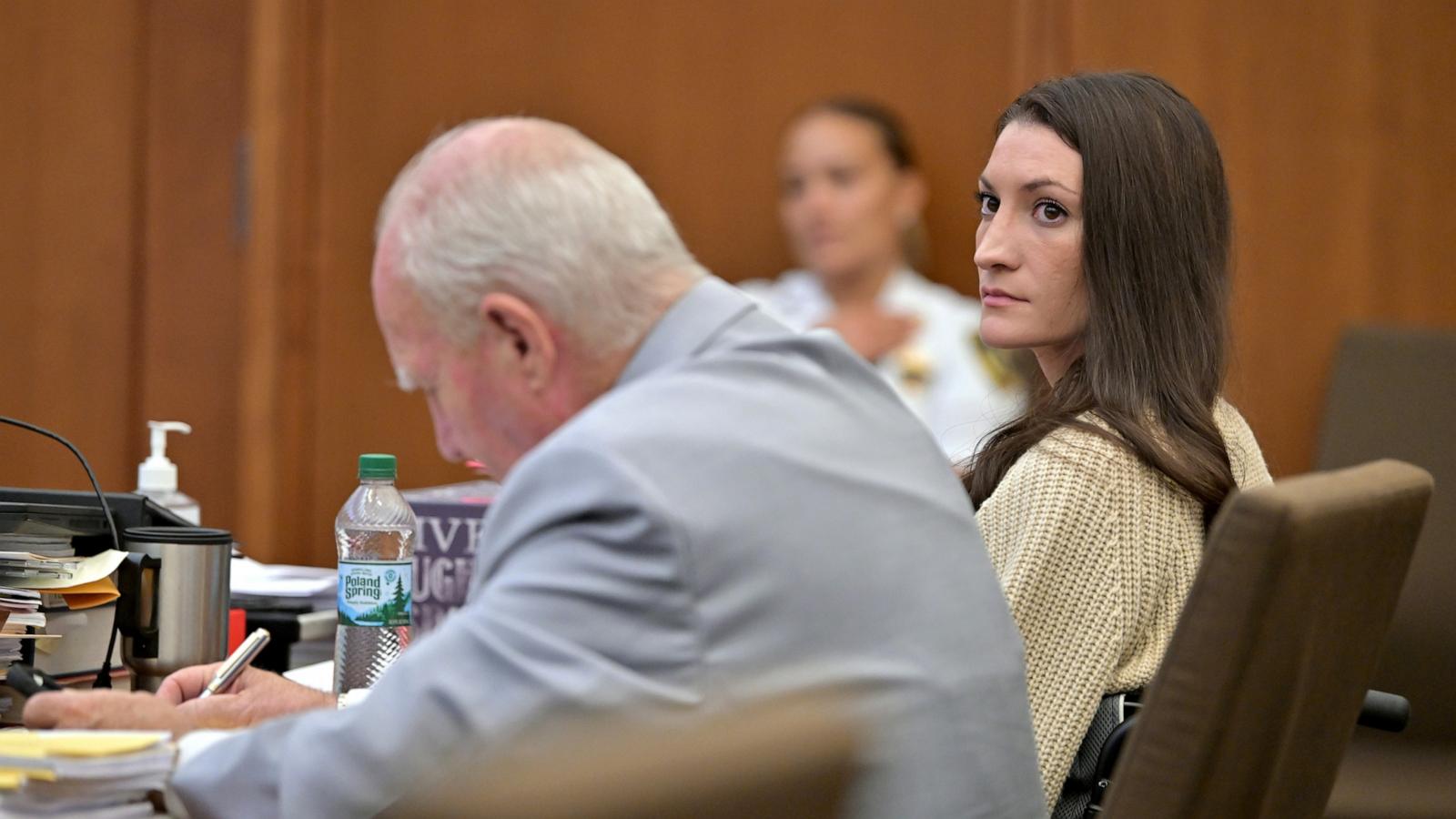 PHOTO: Lindsay Clancy, looks toward reporters in the courtroom as she sits beside her lawyer in the courtroom during proceedings in her murder trial, Aug. 20, 2026, in Plymouth, Mass.