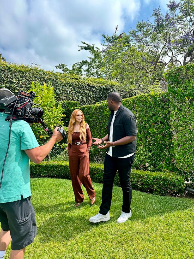 PHOTO: Lindsay Lohan and ABC News' Ike Ejiochi appear in this photo.