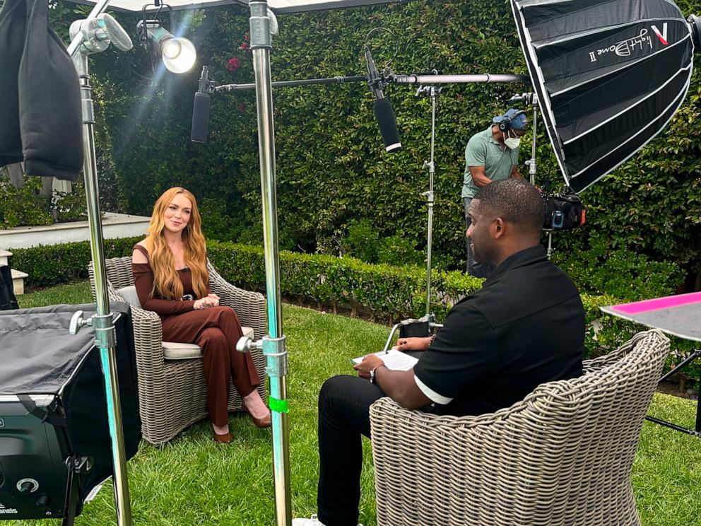 PHOTO: Lindsay Lohan and ABC News reporter Ike Ejiochi appear in this photo.