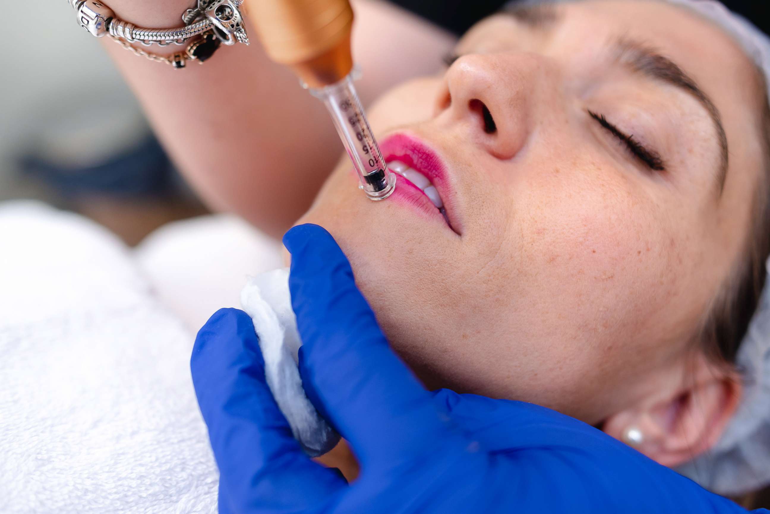 PHOTO: A woman receives hyaluronic acid cosmetic treatment on her lips in this stock image.