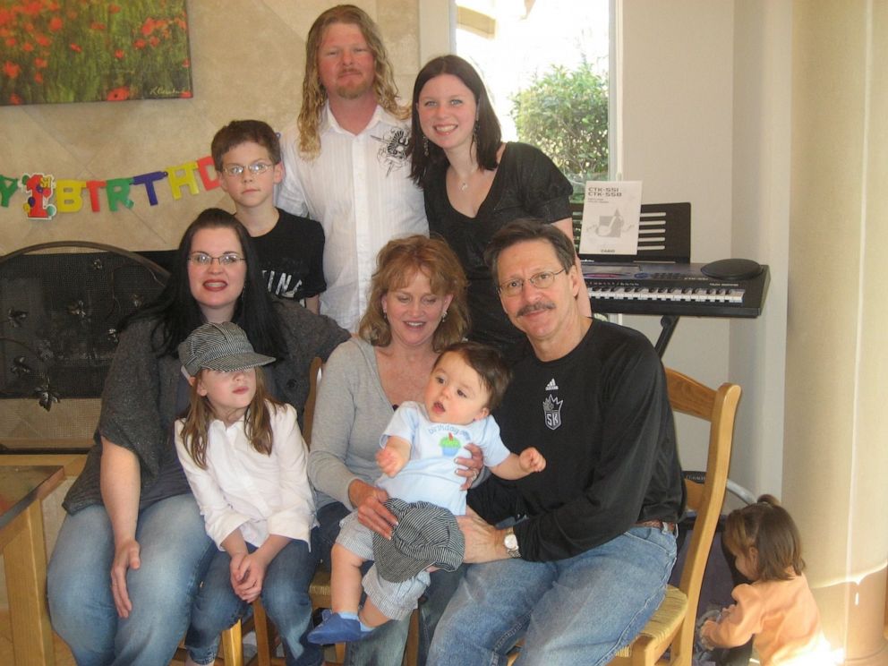 PHOTO: Lisa, her husband, her daughter, and her son with the Honaker family, including Dayne, who Lisa delivered as a gestational surrogate.