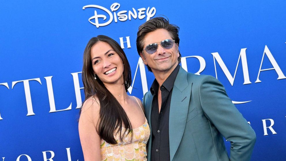 PHOTO: Caitlin McHugh and John Stamos attend the World Premiere of Disney's "The Little Mermaid" on May 8, 2023, in Hollywood, Calif.