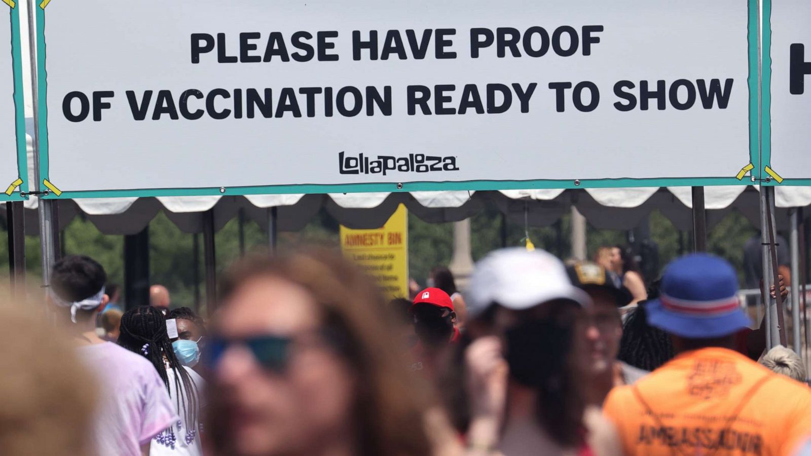 PHOTO: Guests are asked to show proof of having been vaccinated against the COVID-19 virus as they arrive for the first day of the Lollapalooza music festival on July 29, 2021 in Chicago.