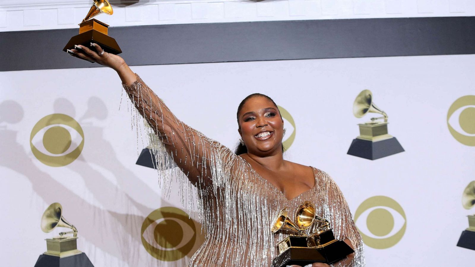 PHOTO: FILE - Lizzo poses backstage with her Best Pop Solo Performance award at the 62nd Grammy Awards, Los Angeles, Jan. 26, 2020.