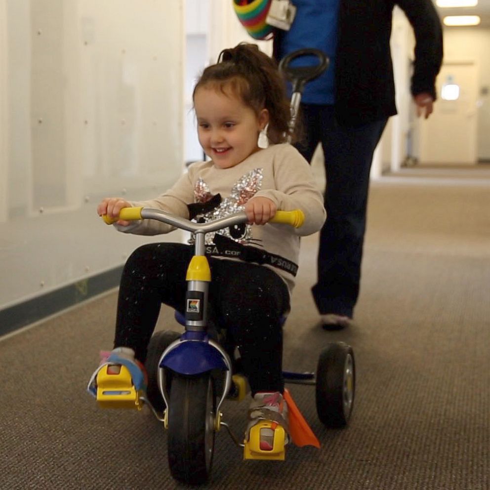 VIDEO: Girl with spina bifida who wasn’t expected to walk loves running and kicking goals 