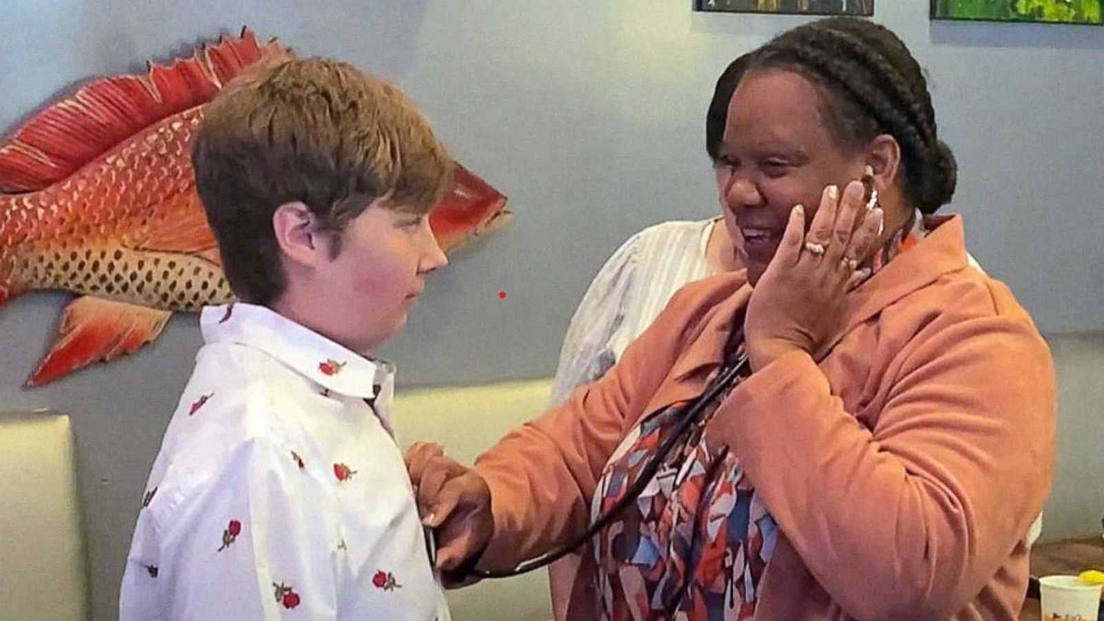 PHOTO: Maria Clark uses a stethoscope to hear the heart of her late son, Nicholas, beating in his transplant recipient, Jean Paul Marceaux.