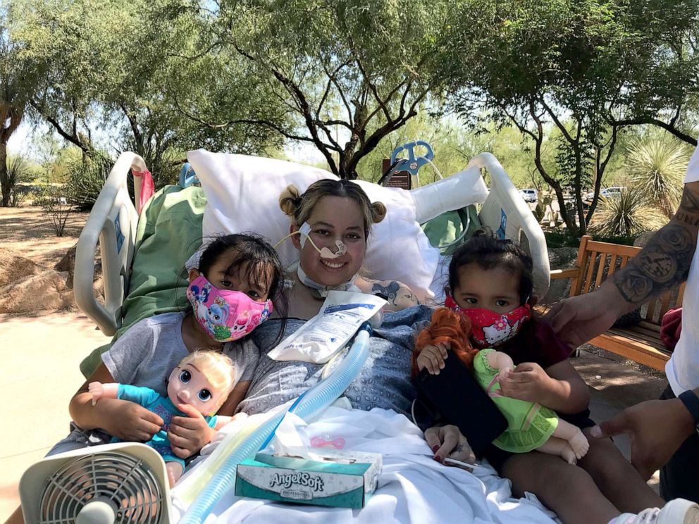 PHOTO: Reyna Lopez poses with her two daughters while hospitalized during her recovery from COVID-19.