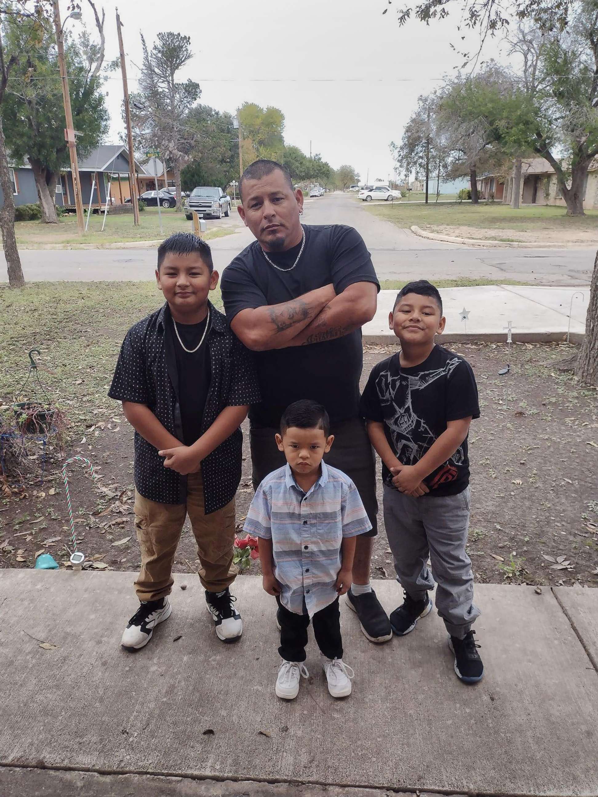 PHOTO: Xavier Lopez, left, poses with his dad and brothers in an undated family photo.