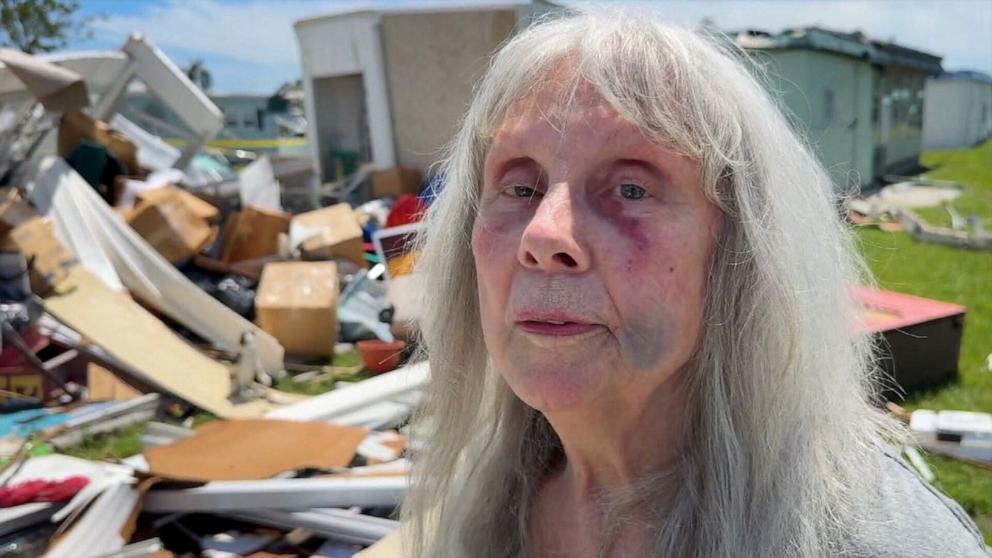 PHOTO: A woman speaks to ABC News about recent storm damage to her home. 
