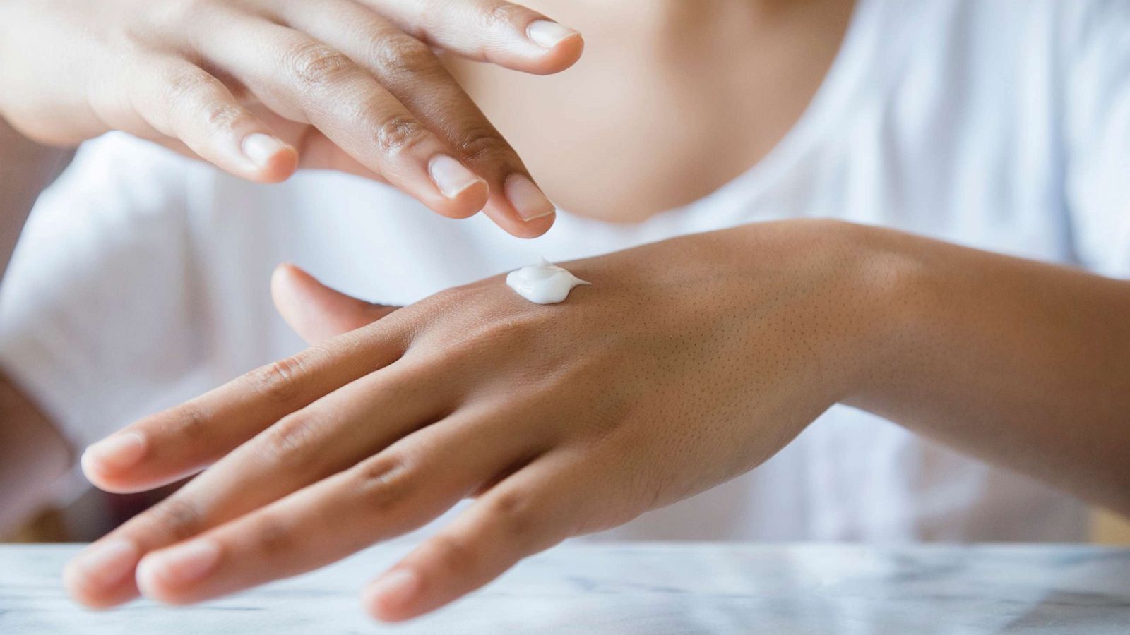 PHOTO: Stock photo of a woman applying lotion.