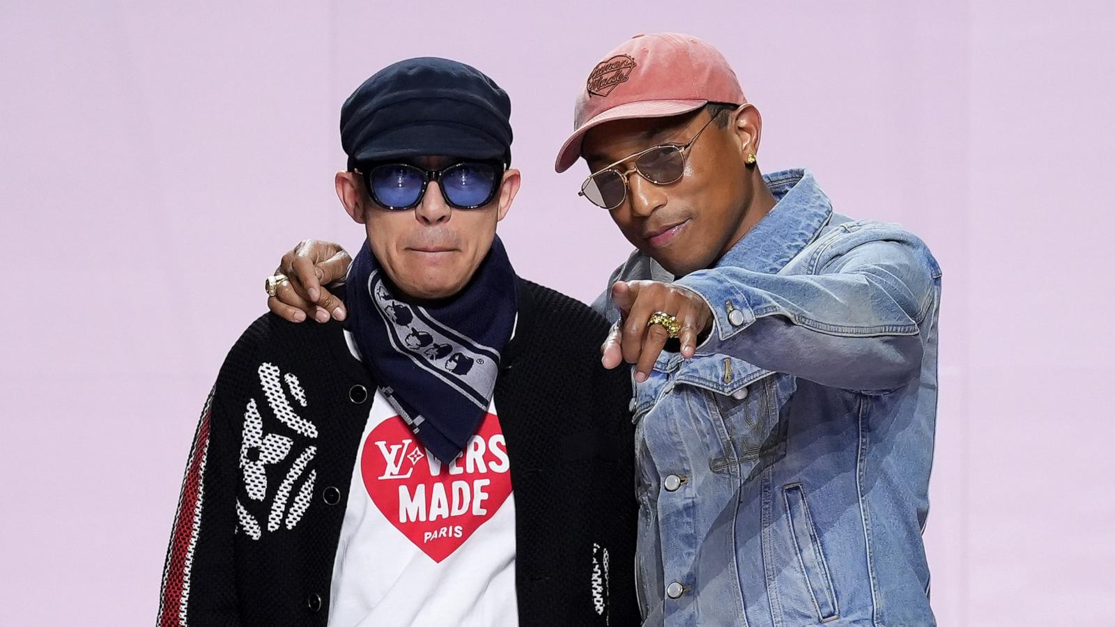 PHOTO: Designers Nigo and Pharrell Williams acknowledge the audience during the Louis Vuitton Menswear Fall-Winter 2025/2026 show as part of Paris Fashion Week, Jan. 21, 2025, in Paris.