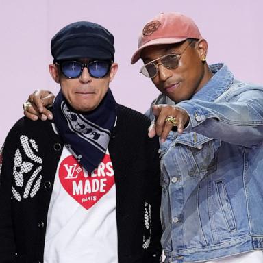 PHOTO: Designers Nigo and Pharrell Williams acknowledge the audience during the Louis Vuitton Menswear Fall-Winter 2025/2026 show as part of Paris Fashion Week, Jan. 21, 2025, in Paris.