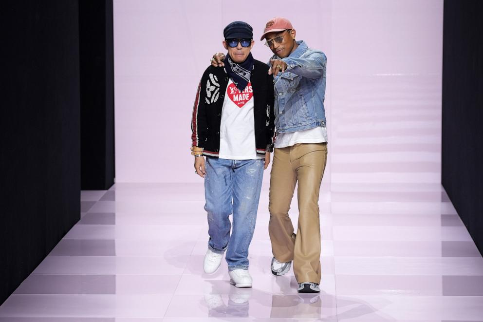 PHOTO: Designers Nigo and Pharrell Williams acknowledge the audience during the Louis Vuitton Menswear Fall-Winter 2025/2026 show as part of Paris Fashion Week, Jan. 21, 2025, in Paris.