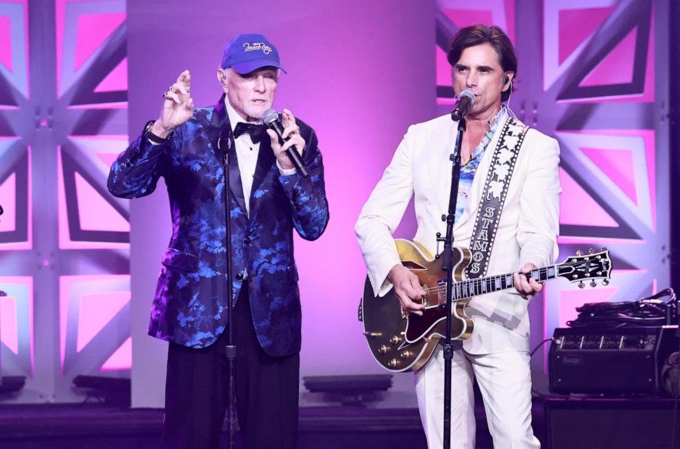 PHOTO: Mike Love and John Stamos perform onstage during the 2025 Songwriters Hall Of Fame Induction Ceremony at Marriott Marquis Times Square, June 12, 2025, in New York.