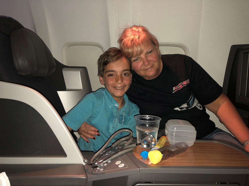 PHOTO: Luca Ingrassia with the nurse who saved his life on his flight after he experienced an allergic reaction.