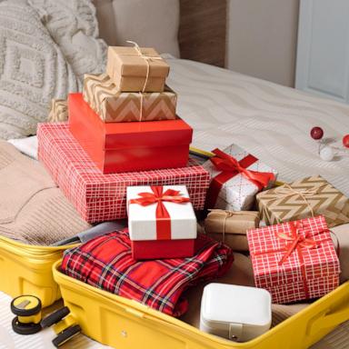 PHOTO: Still life composition with suitcase before Christmas travelling.