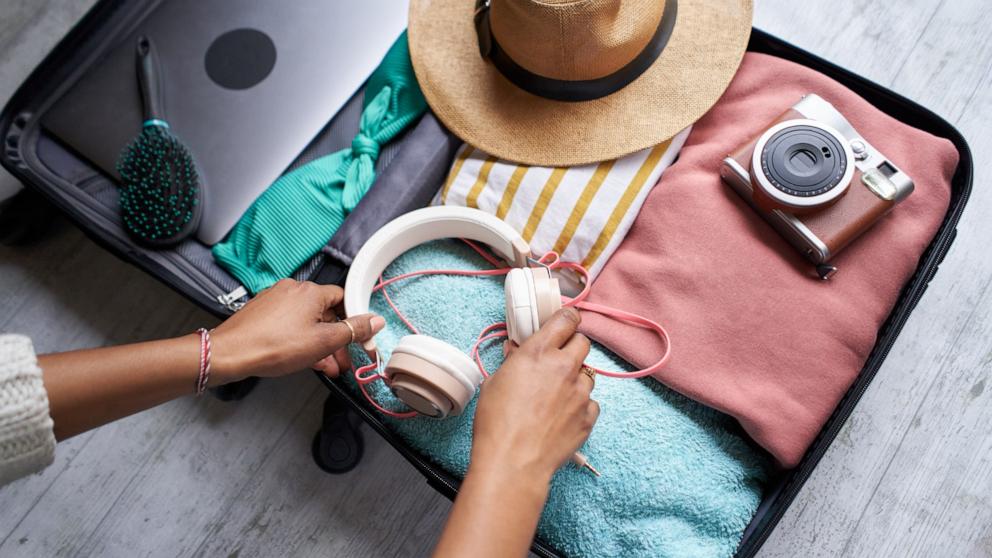 PHOTO: In this undated stock photo, a woman packs her luggage for a trip.