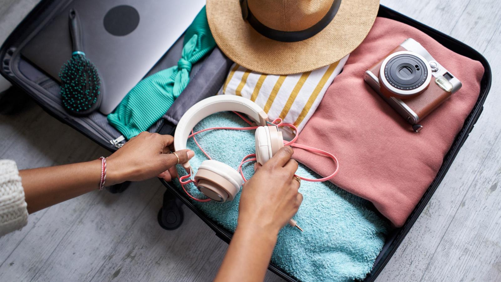 PHOTO: In this undated stock photo, a woman packs her luggage for a trip.