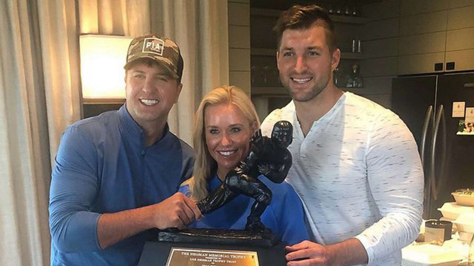 PHOTO: Luke Bryan and Tim Tebow appear in a photo with Bryan's wife, Caroline, in an image posted to Bryan's Instagram account on Dec. 13, 2020, with the text, "Pranksmas starts today. I still reign king of pranks in our house."