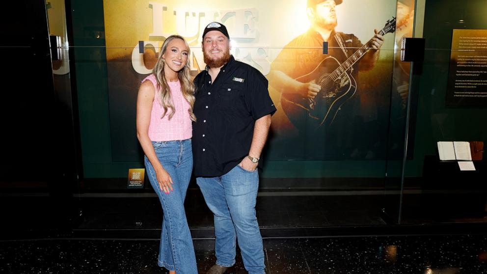 PHOTO: Nicole Combs and Luke Combs attend the new exhibit Luke Combs: The Man I Am at Country Music Hall of Fame and Museum, on July 10, 2024, in Nashville, Tenn.