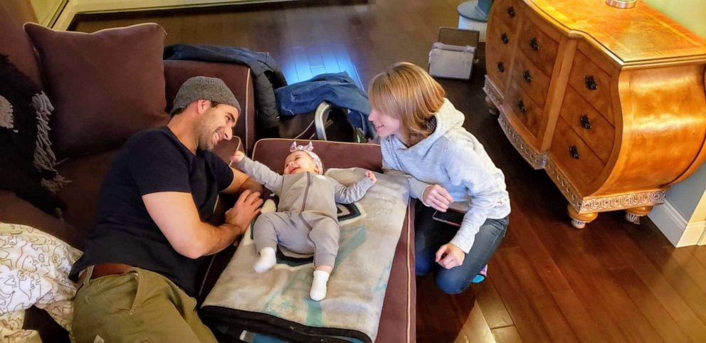 PHOTO: Luke Adams poses with his girlfriend Abbi Hake and their daughter Remy.