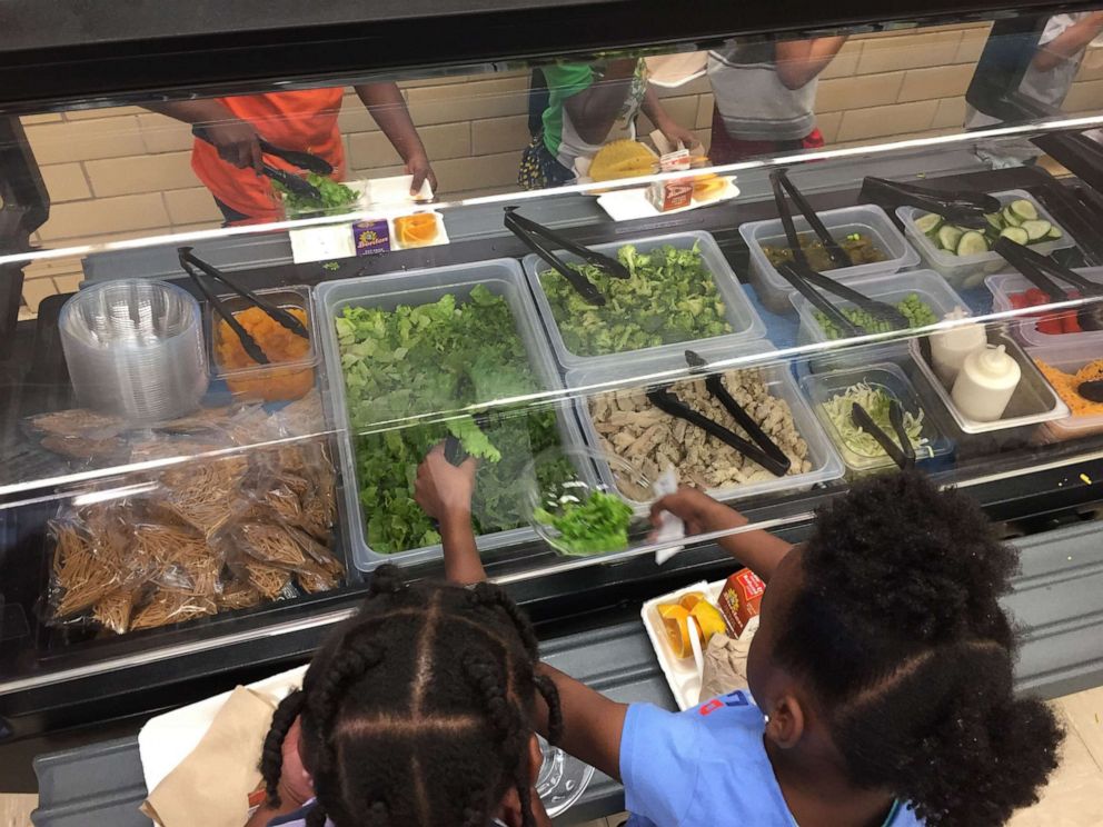 PHOTO: Children help themselves to lunch at a school within Austin Independent School District in Austin, Texas.