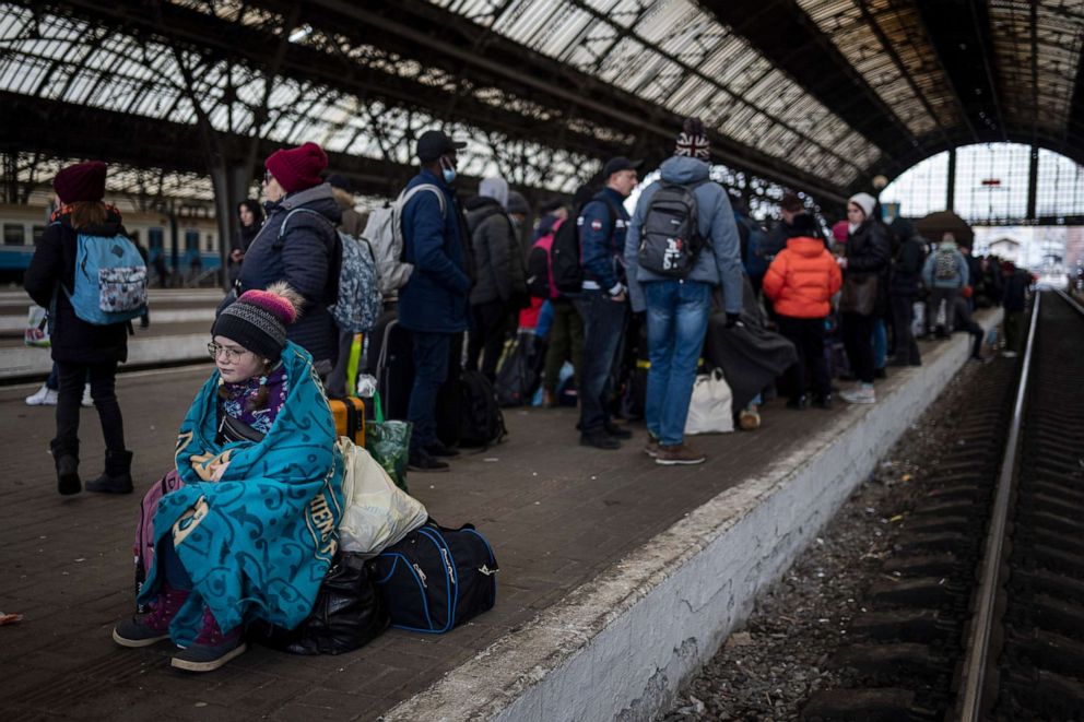 PHOTO: Passengers wait at the platform inside Lviv railway station, Feb. 27, 2022, in Lviv, Ukraine.