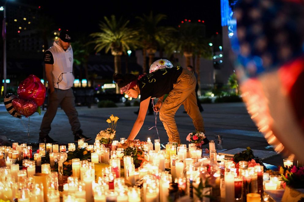 PHOTO: Priscilla Olivas lights up a candle at a street vigil held along the Las Vegas Strip after 58 people were killed and hundreds were wounded at the Route 91 Harvest Country Music Festival on Oct. 2, 2017 in Las Vegas.