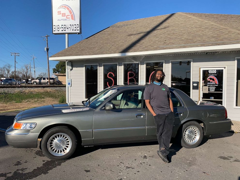 PHOTO: Edward (Ed) Hays Jr. 28, stands in front of his car, a 2001 Mercury Grand Marquis, at at SBC Autos in Bossier City, Louisiana.
