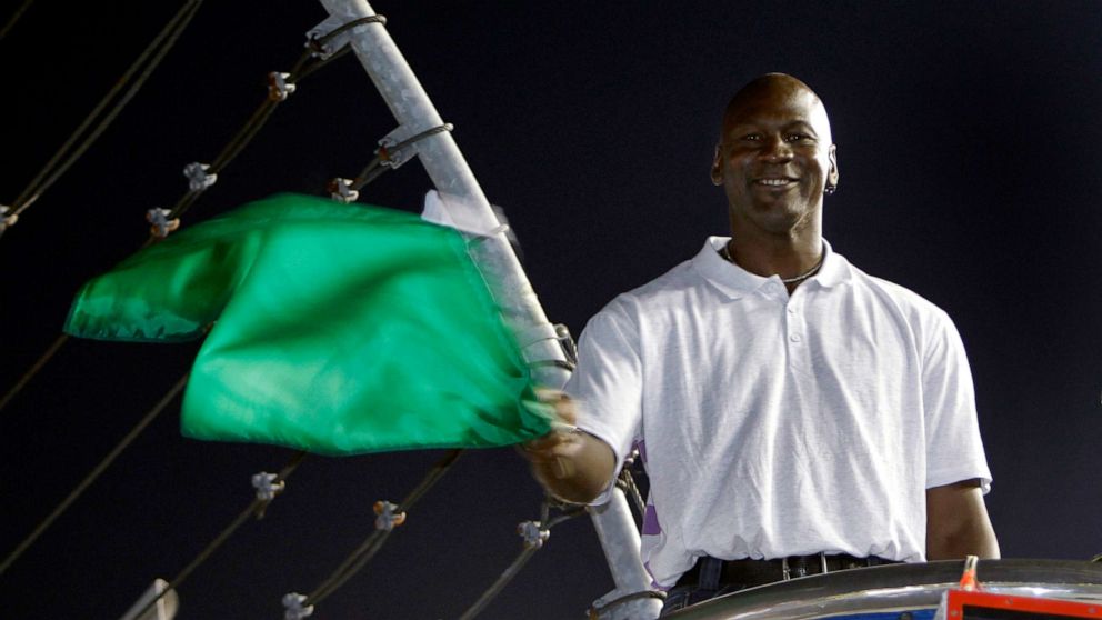PHOTO: Michael Jordan practices waving the green flag before a NASCAR All-Star auto race at Charlotte Motor Speedway in Concord, N.C., May 22, 2010.