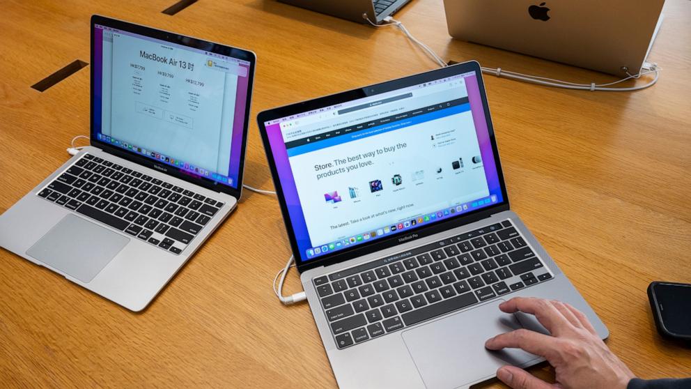 PHOTO: A shopper is seen using a Macbook Pro computer at an Apple store in Hong Kong, Nov. 29, 2021. 