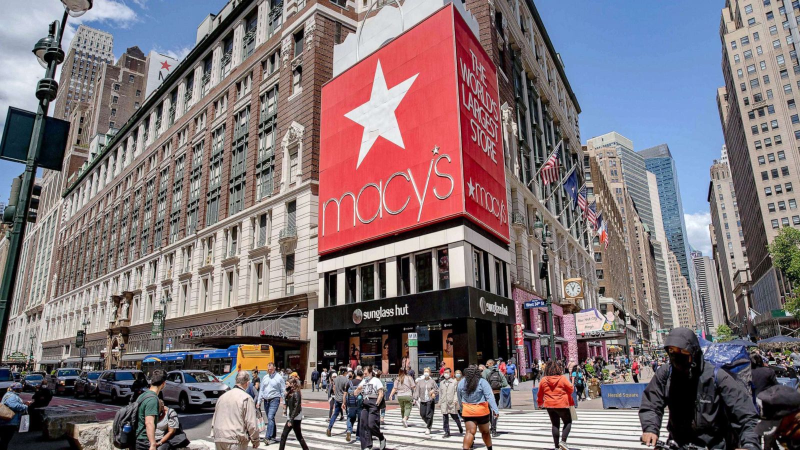 PHOTO: Pedestrians pass in front of Macy's Inc. flagship department store in the Herald Square area of New York, May 13, 2021.