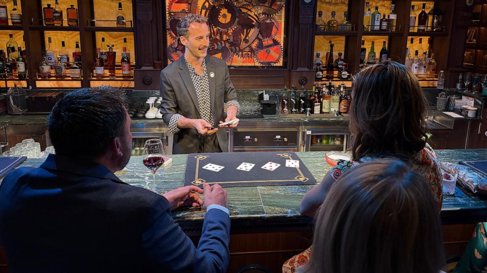 PHOTO: A magician at Spellbound by Magic Castle captivates guests with spectacular magic tricks and delicious cocktails.