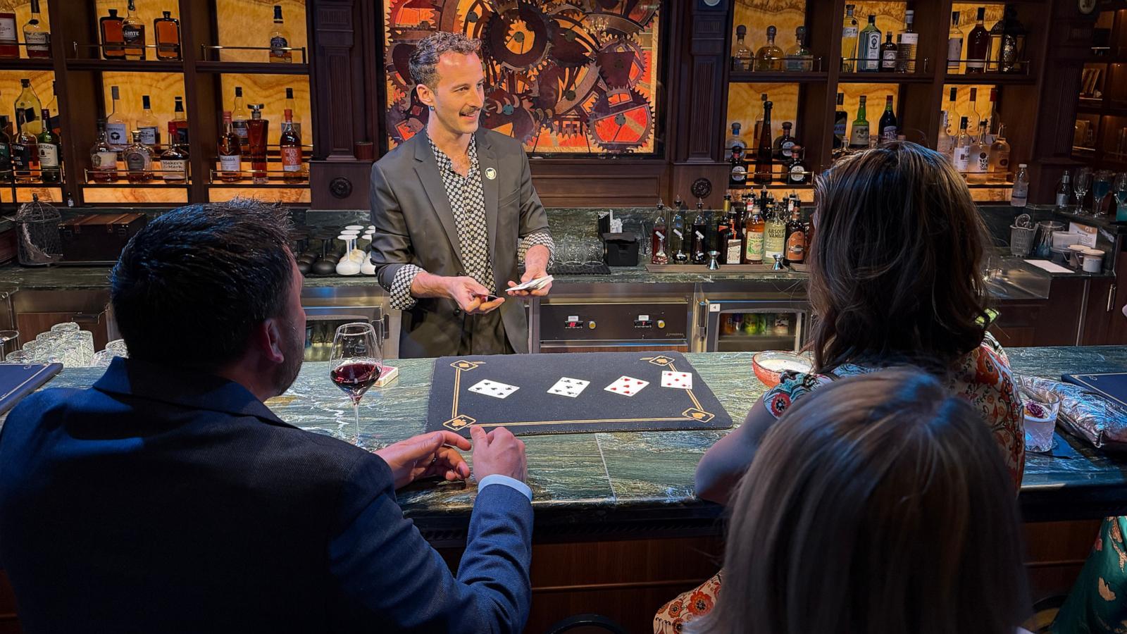 PHOTO: A magician at Spellbound by Magic Castle captivates guests with spectacular magic tricks and delicious cocktails.