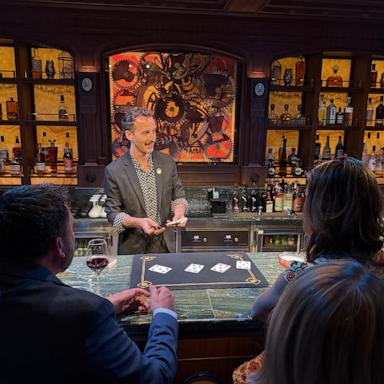 PHOTO: A magician at Spellbound by Magic Castle captivates guests with spectacular magic tricks and delicious cocktails.