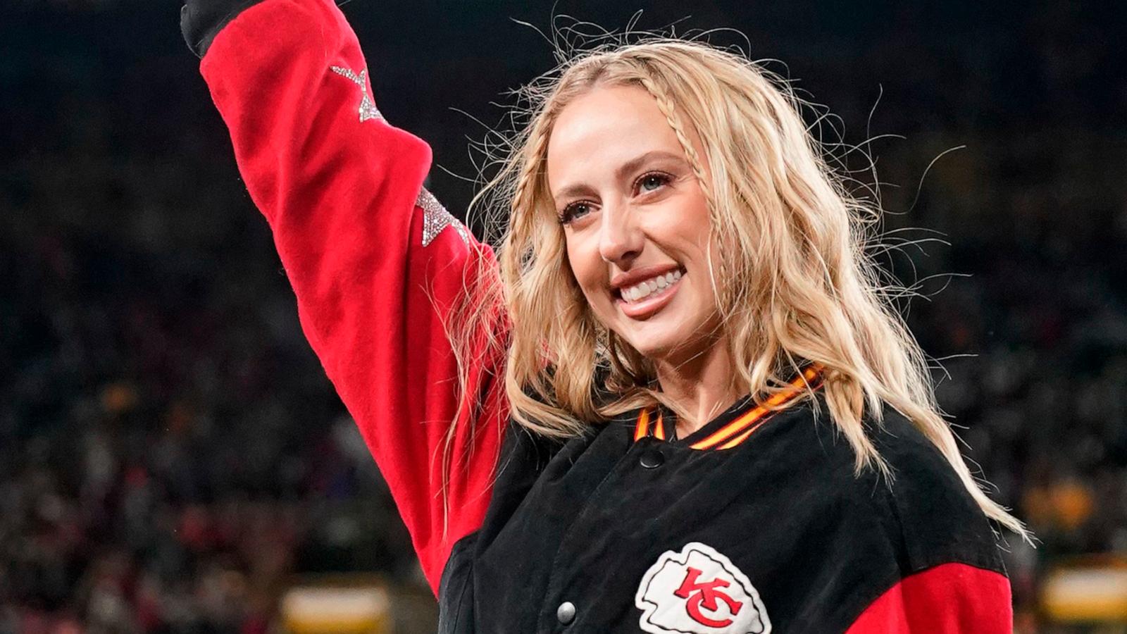 PHOTO: Brittany Mahomes, wife of Patrick Mahomes #15 of the Kansas City Chiefs , waves before the game between the Kansas City Chiefs and the Green Bay Packers at Lambeau Field, Dec. 3, 2023, in Green Bay, Wis.