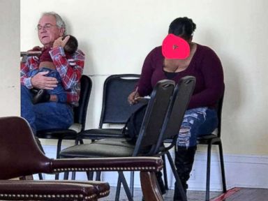 The story behind viral photo of man cradling baby that was shared around the world