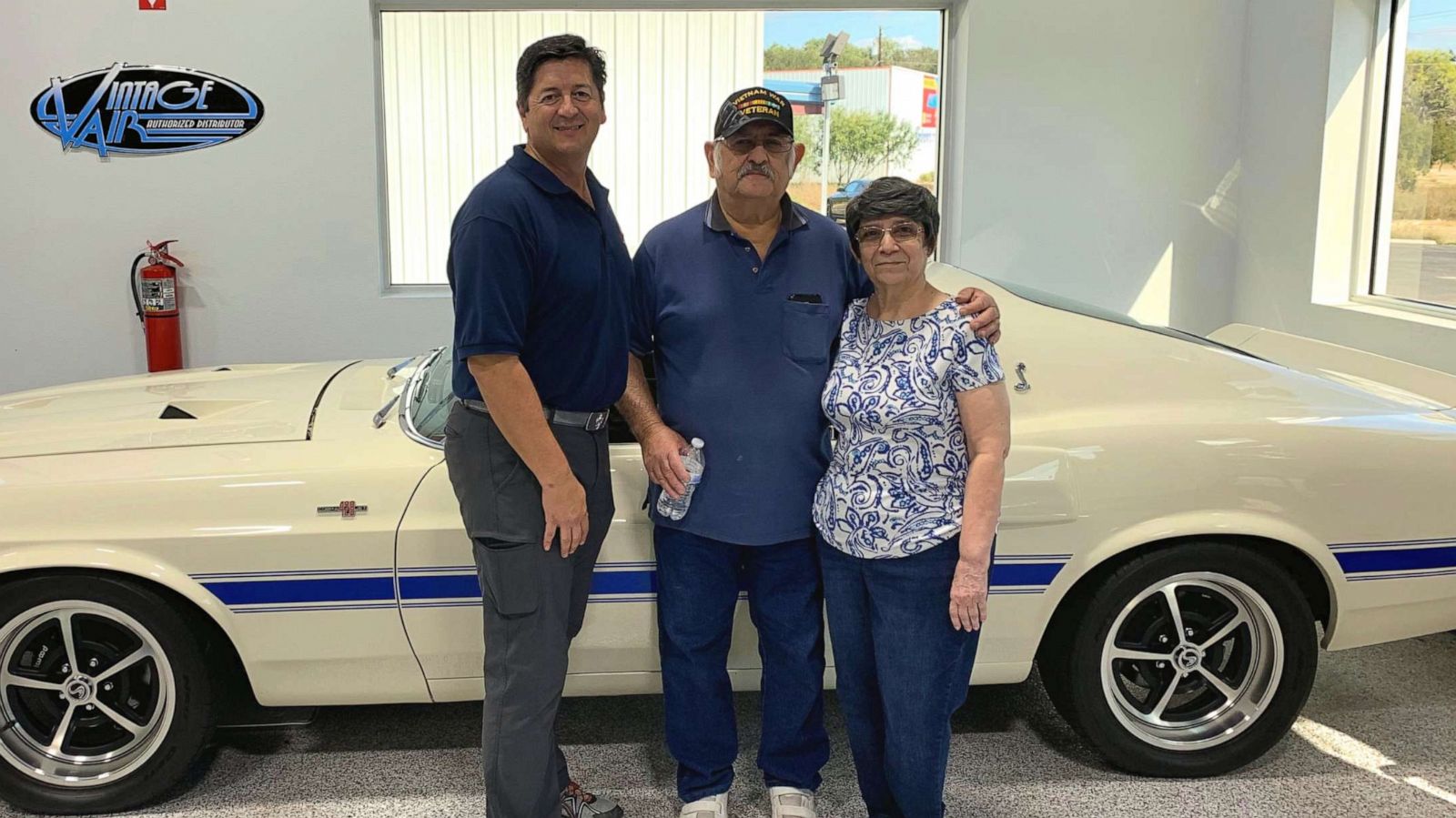PHOTO: Rudy Quinones, owner of Renown Auto Restoration in San Antonio, is seen in a recent photo with Albert Brigas and his wife wife of 44 years, Sylvia Brigas.