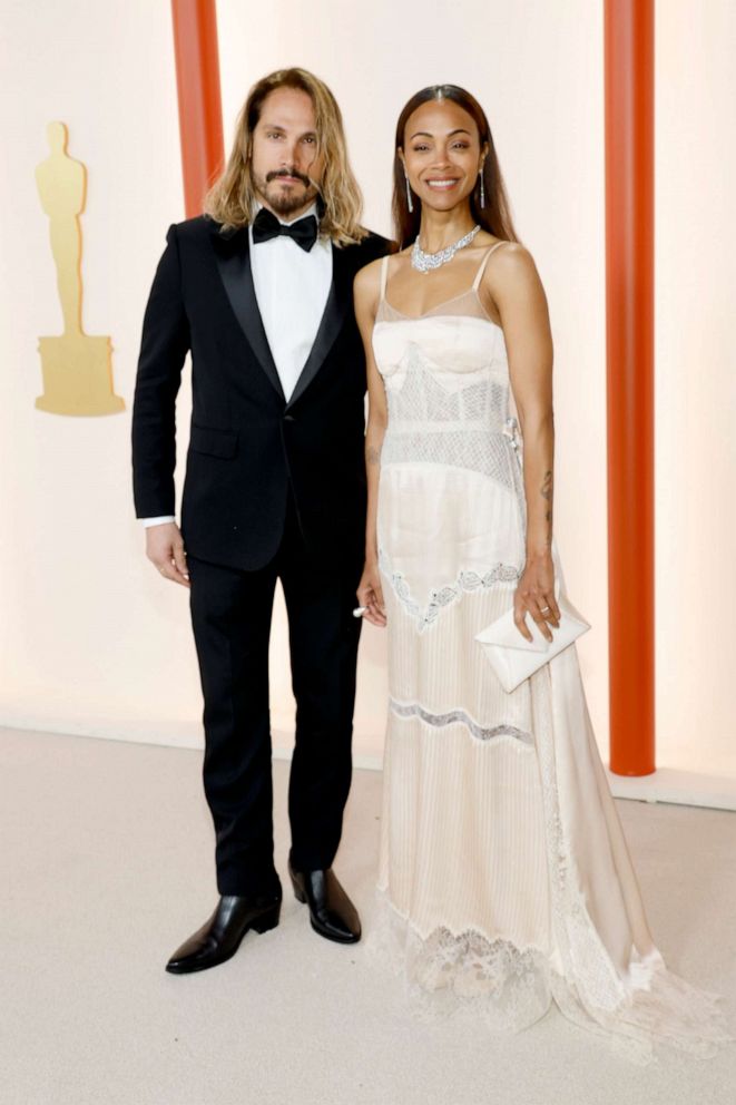 PHOTO: Marco Perego and Zoe Saldana attend the 95th Annual Academy Awards on March 12, 2023 in Hollywood.
