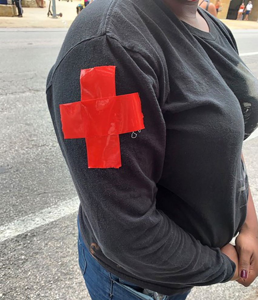 PHOTO: Anna Maria Ruiz joins a protest in Austin, Texas, May 31, 2020, condemning the death of George Floyd before heading in for work at North Austin Medical Center.