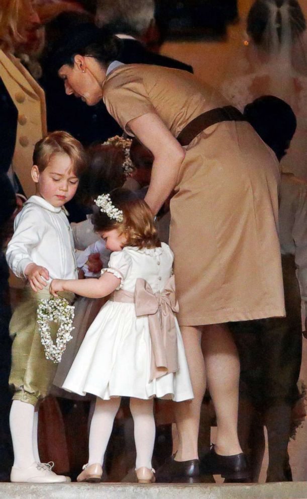 PHOTO:Prince George of Cambridge and Princess Charlotte of Cambridge accompanied by their nanny Maria Teresa Borrallo attend the wedding of Pippa Middleton and James Matthews at St Mark's Church, May 20, 2017, in Englefield Green, England. 