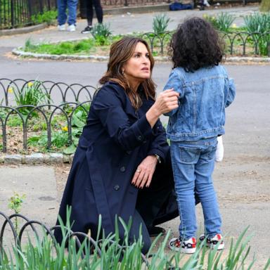 [PHOTO: Mariska Hargitay is seen taking a break from filming 'Law and Order: SVU' as she helps a child at the Fort Tryon Playground, on April 10, 2024, in New York.]