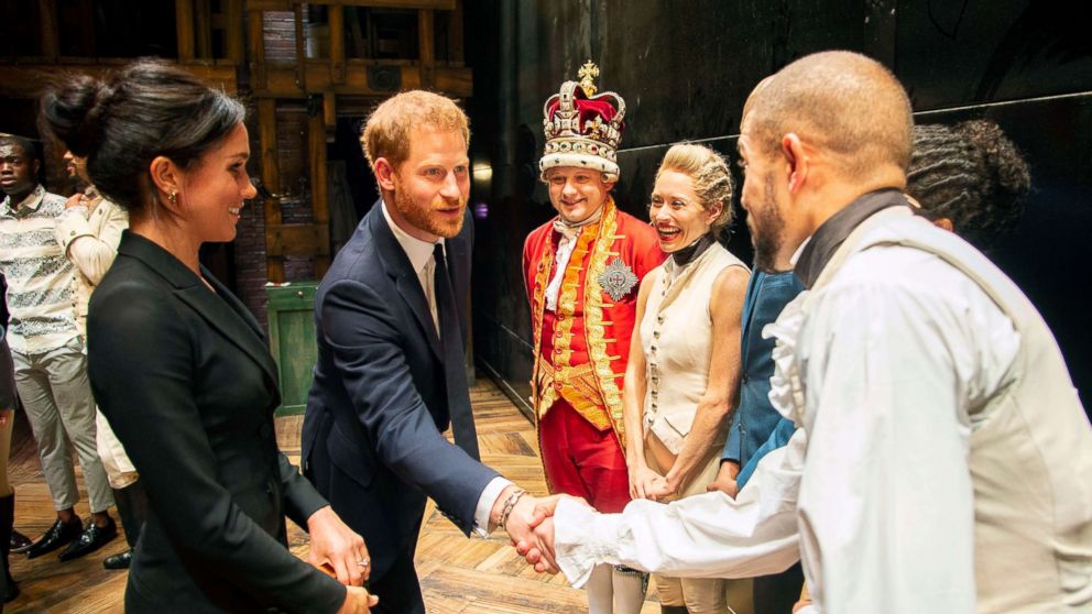 PHOTO: Prince Harry and Duchess Meghan Markle of Sussex after the performance meeting cast and crew backstage at the Victoria Palace Theatre, London, Aug. 30, 2018.