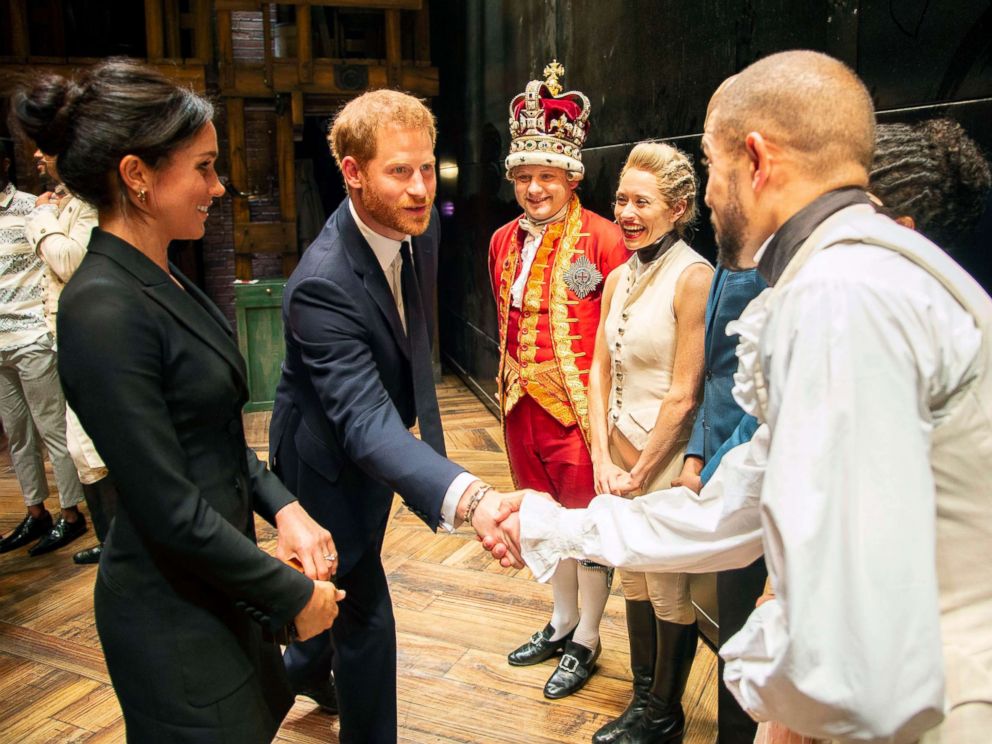 PHOTO: Prince Harry and Duchess Meghan Markle of Sussex after the performance meeting cast and crew backstage at the Victoria Palace Theatre, London, Aug. 30, 2018.
