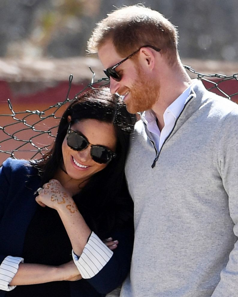 PHOTO:Britain's Prince Harry and Meghan, Duchess of Sussex, watch children playing football at a school in the town of Asni, in the Atlas mountains, Morocco, Feb. 24, 2019.